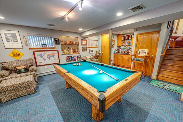 rec room with track lighting, visible vents, dark colored carpet, recessed lighting, and a baseboard heating unit