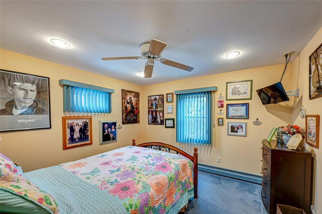 carpeted bedroom with a ceiling fan, baseboards, recessed lighting, and baseboard heating