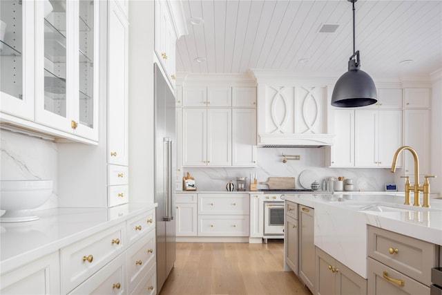 kitchen featuring wood ceiling, light stone counters, light hardwood / wood-style flooring, hanging light fixtures, and white cabinets