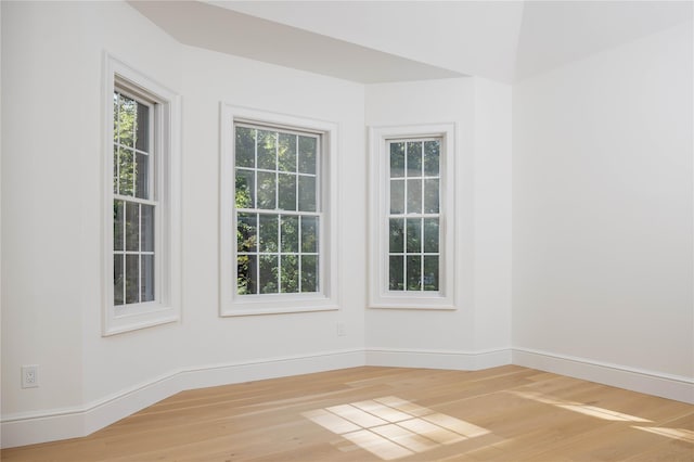 unfurnished room with hardwood / wood-style floors