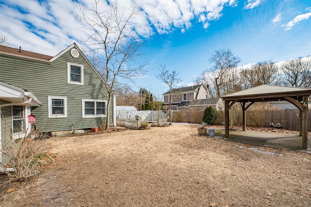 view of yard with a gazebo, a patio area, and a fenced backyard