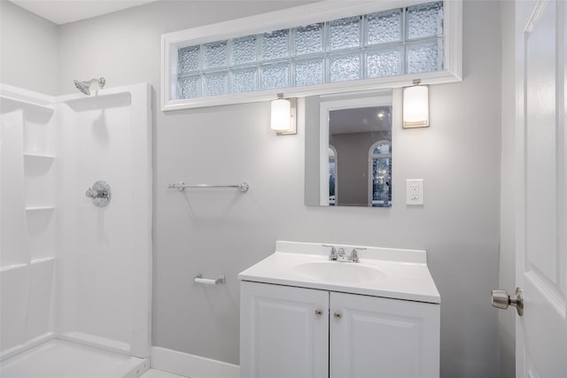 bathroom featuring vanity and walk in shower