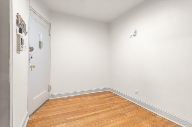 unfurnished room with light hardwood / wood-style floors