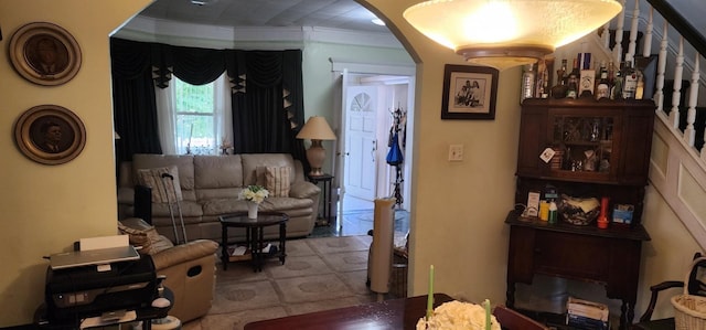 living room featuring crown molding