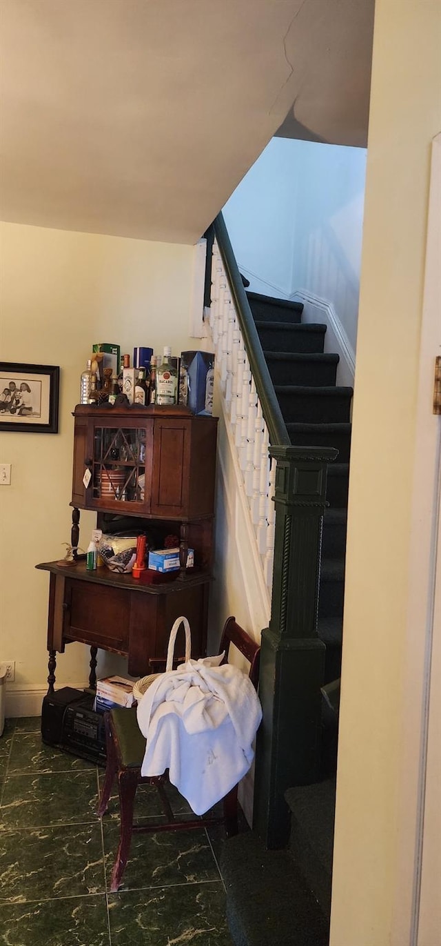 office space featuring marble finish floor and baseboards