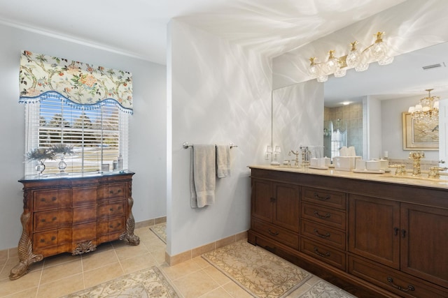 bathroom featuring tile patterned flooring, vanity, and a shower