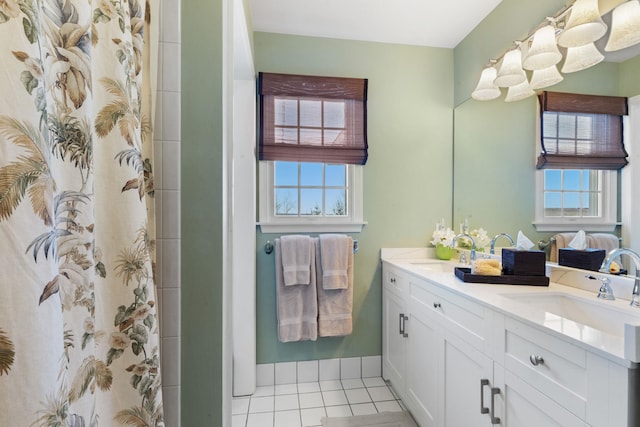 bathroom with tile patterned flooring, vanity, a wealth of natural light, and a shower with shower curtain