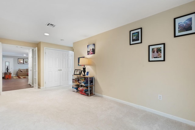 playroom featuring light carpet