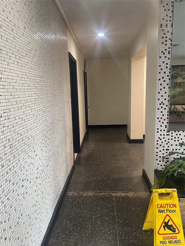 hallway with tile walls