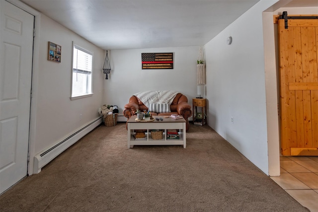 living area with a barn door, a baseboard heating unit, and carpet