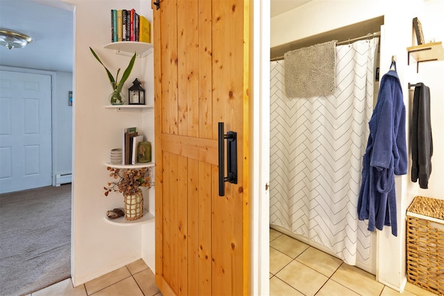 bathroom featuring tile patterned flooring and baseboard heating