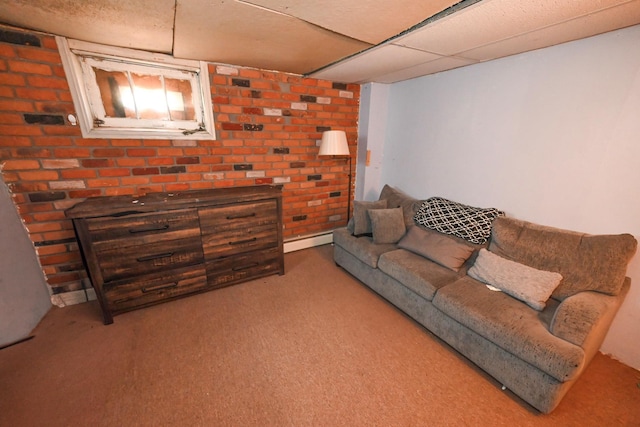 living room featuring a drop ceiling, light carpet, and a baseboard heating unit