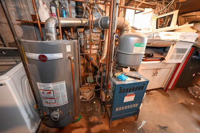 utility room featuring washer / clothes dryer and gas water heater