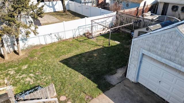 view of yard with a garage and an outdoor structure