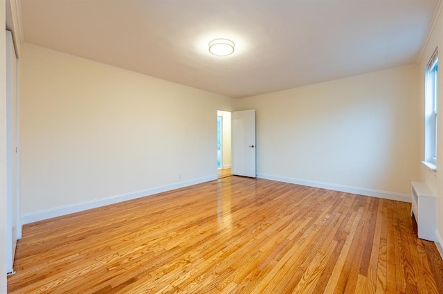 spare room featuring light hardwood / wood-style flooring