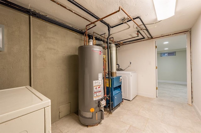 utility room featuring independent washer and dryer and water heater