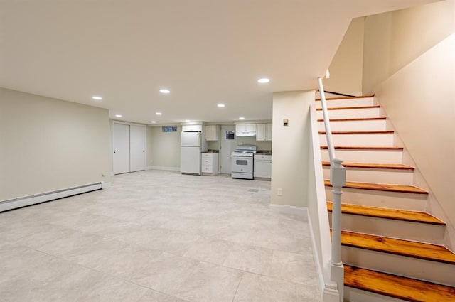 interior space featuring baseboard heating and white fridge