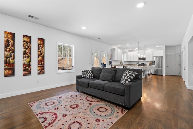 living room featuring dark hardwood / wood-style floors