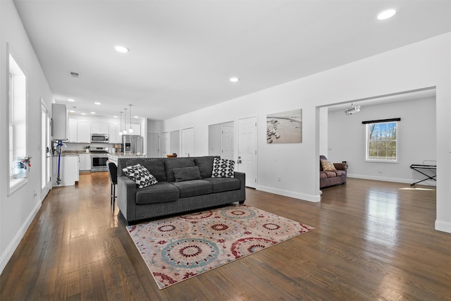 living room with dark hardwood / wood-style floors