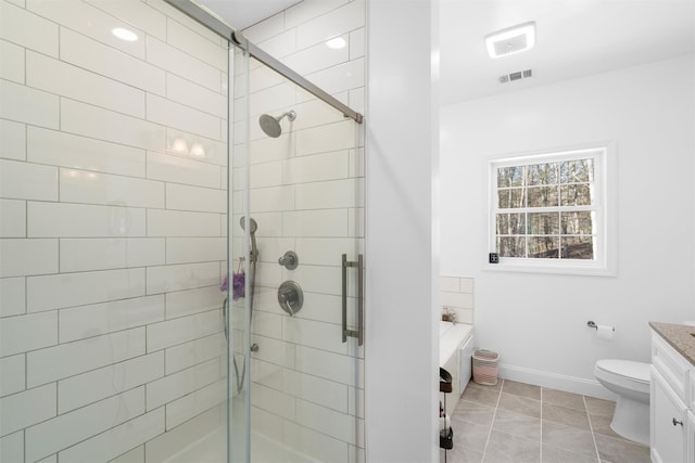 full bathroom featuring independent shower and bath, vanity, tile patterned floors, and toilet