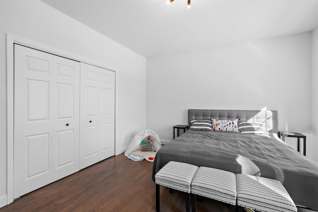 bedroom featuring a closet and dark hardwood / wood-style floors