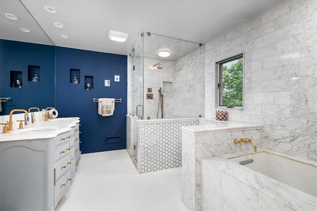 bathroom featuring vanity and separate shower and tub