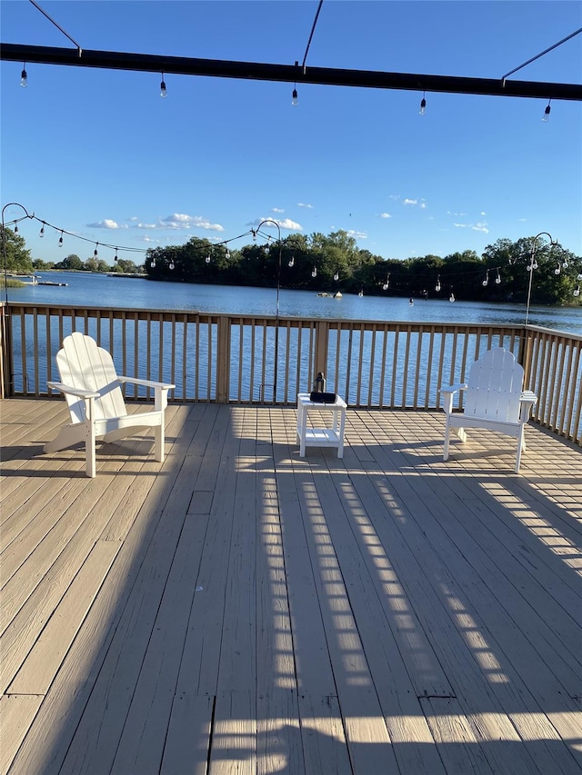 dock area featuring a deck with water view