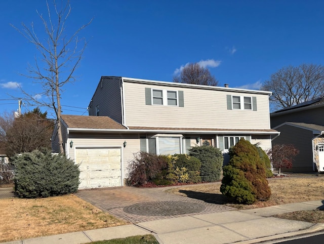 front facade with a garage