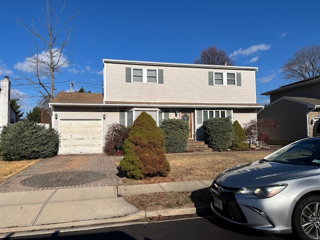 front facade with a garage