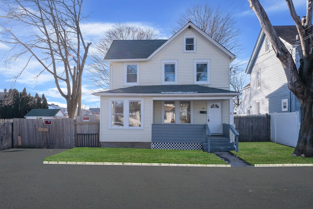 46 3rd Ave, Huntington Station, NY 11746 - front of property featuring a front lawn