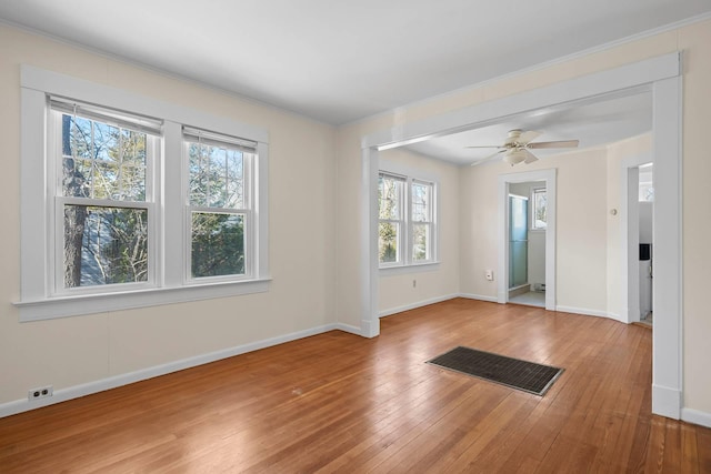 unfurnished room with ceiling fan and light wood-type flooring