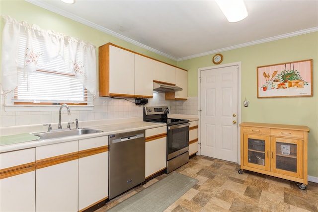 kitchen featuring appliances with stainless steel finishes, sink, white cabinets, decorative backsplash, and ornamental molding