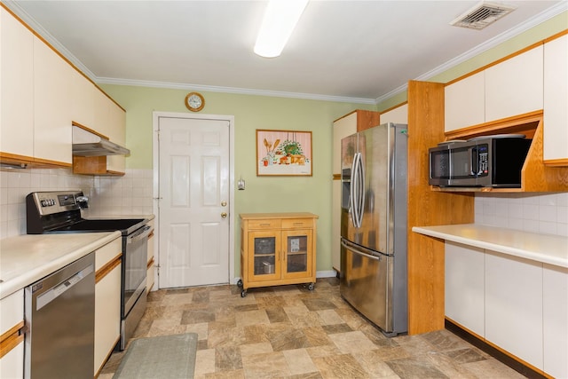 kitchen featuring tasteful backsplash, ornamental molding, stainless steel appliances, and white cabinets