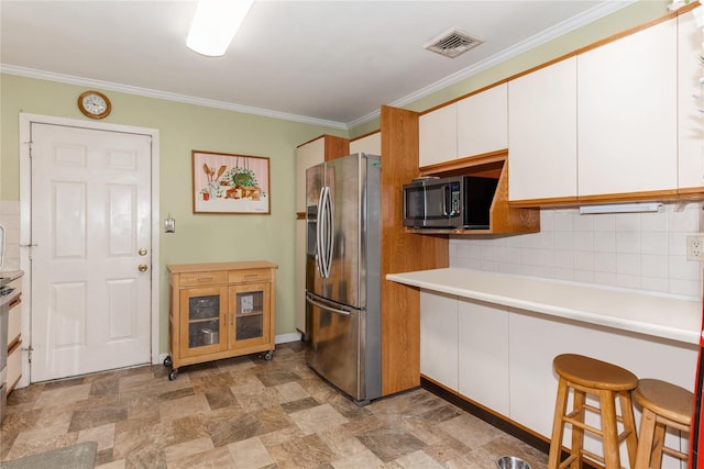 kitchen featuring tasteful backsplash, white cabinets, a kitchen breakfast bar, crown molding, and stainless steel refrigerator with ice dispenser