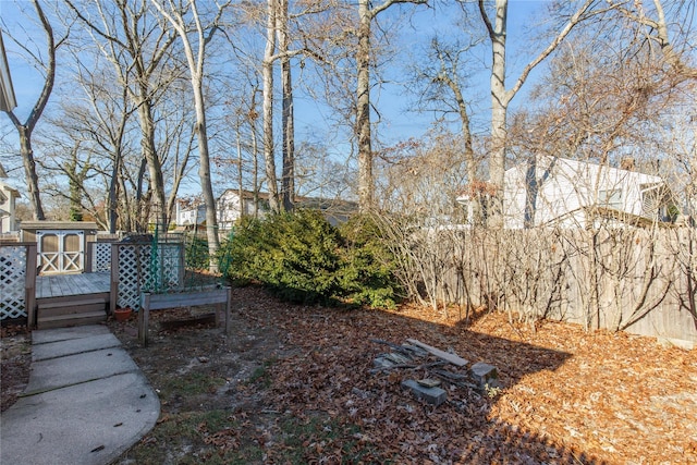 view of yard featuring a wooden deck