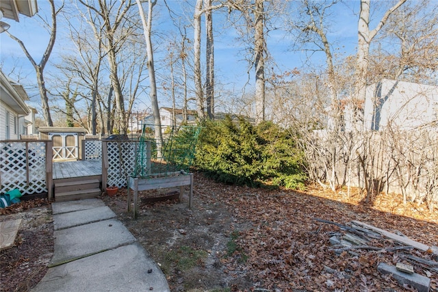 view of yard featuring a wooden deck