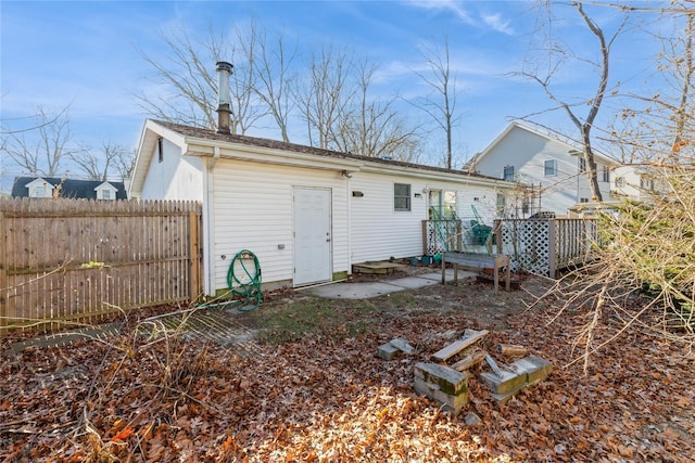 rear view of house with a deck