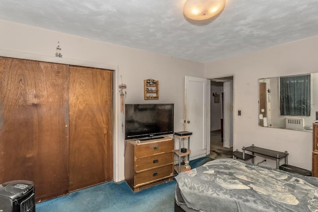 carpeted bedroom with a closet