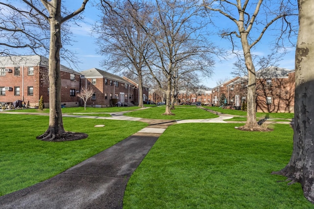 view of home's community with a lawn