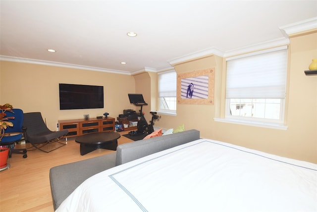 bedroom featuring crown molding and wood-type flooring