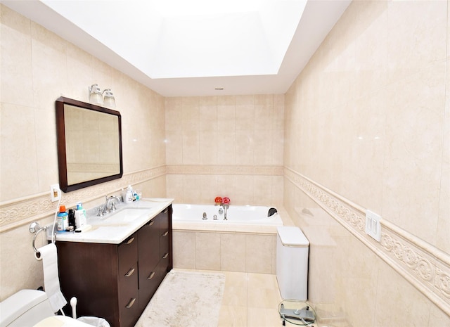 bathroom with tile patterned floors, toilet, tile walls, and vanity