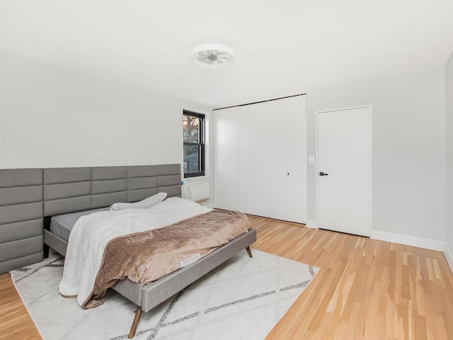 bedroom with hardwood / wood-style floors