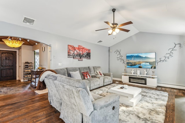 living room with baseboard heating, ceiling fan, lofted ceiling, and dark wood-type flooring