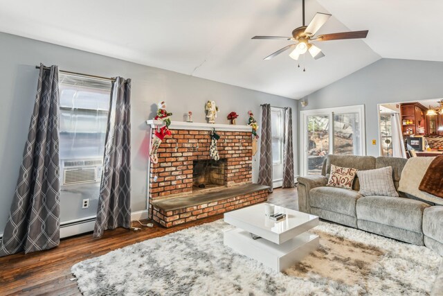 living room featuring dark wood-type flooring, cooling unit, a baseboard heating unit, a brick fireplace, and vaulted ceiling