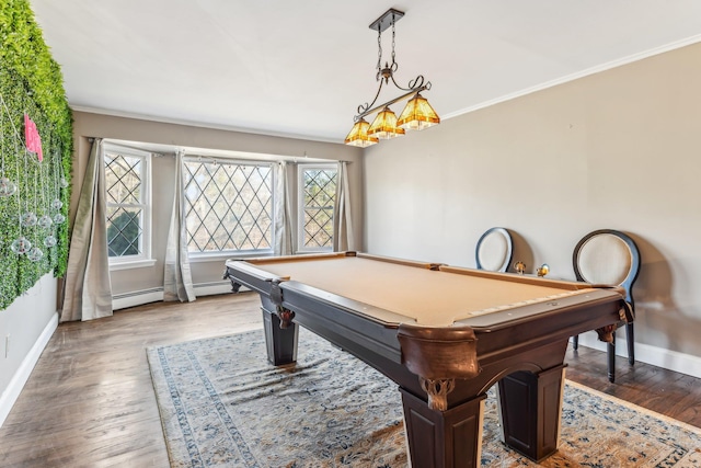 game room featuring hardwood / wood-style floors, ornamental molding, and baseboard heating