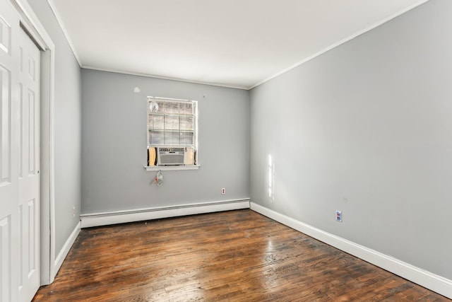 unfurnished bedroom featuring crown molding, a baseboard heating unit, cooling unit, and dark wood-type flooring