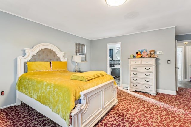 carpeted bedroom featuring crown molding and ensuite bathroom