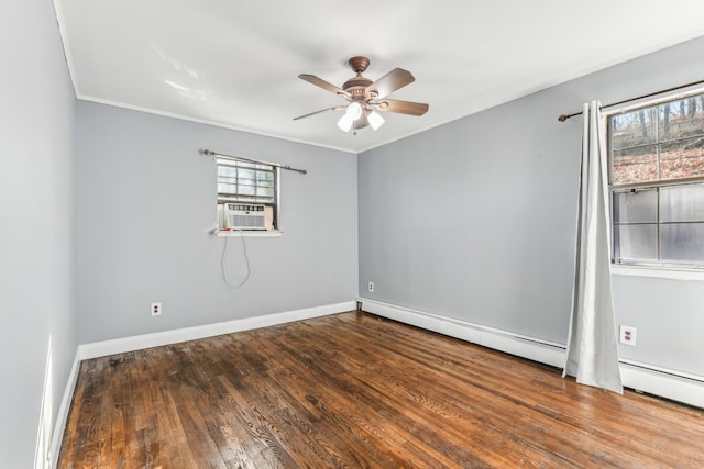 spare room featuring cooling unit, hardwood / wood-style floors, crown molding, and ceiling fan