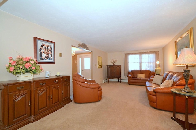 carpeted living room with a baseboard heating unit