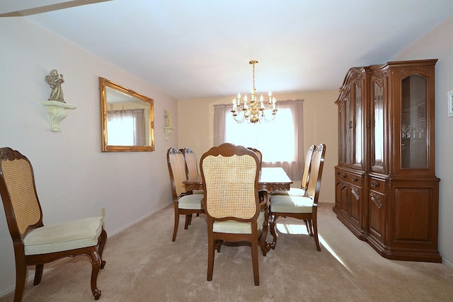 carpeted dining space with a notable chandelier and a wealth of natural light